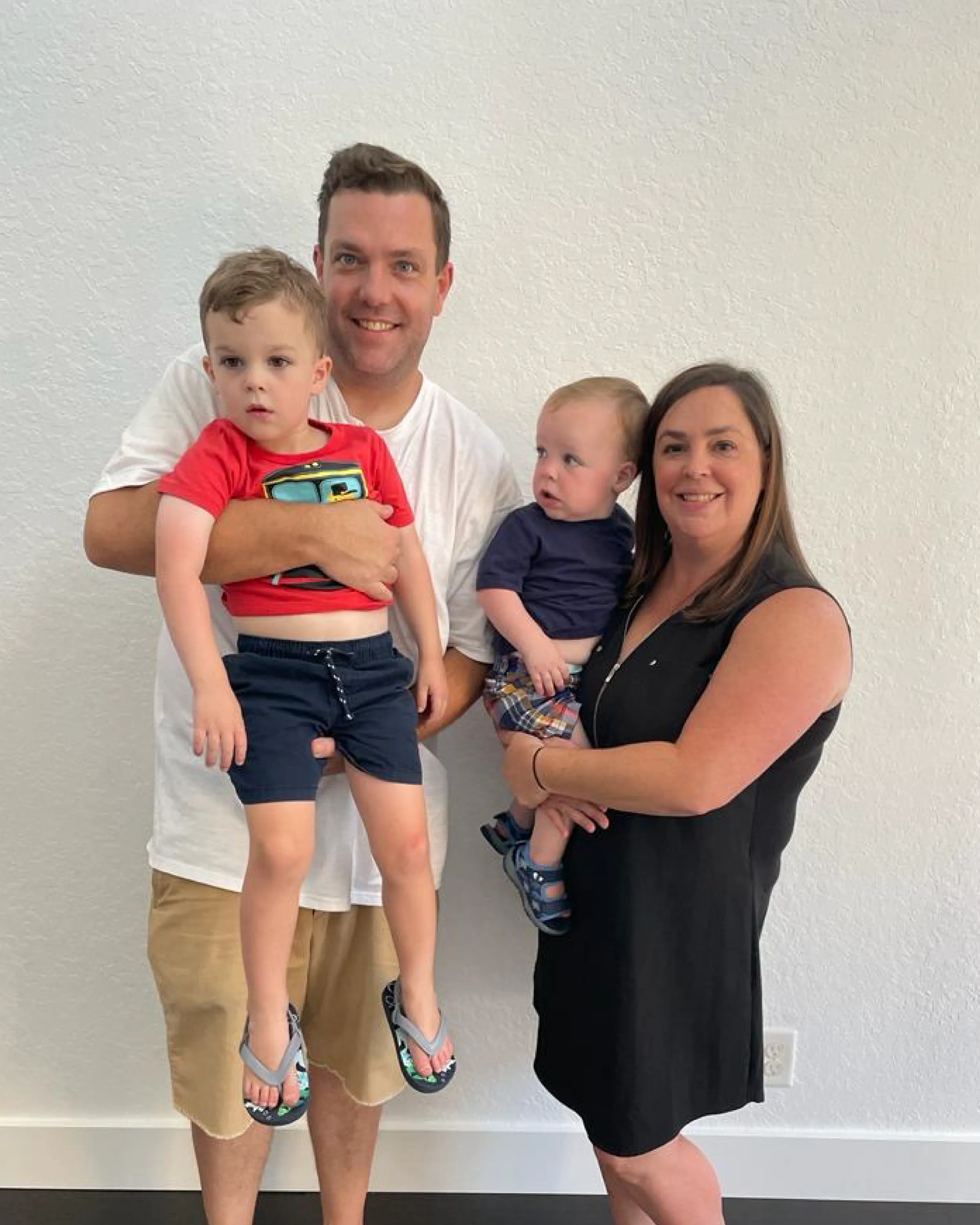 Alison and John with two of their young children.